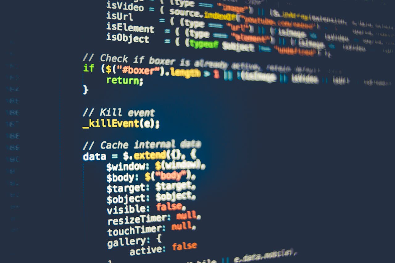 services-05 Close-up of colorful programming code displayed on a computer screen, showcasing modern coding concepts.